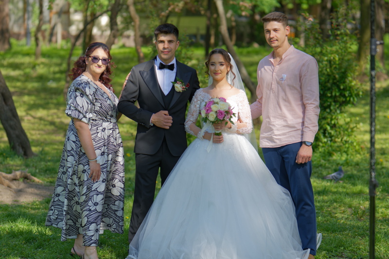 Bride and groom posing in the park